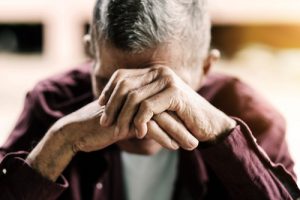 man feeling hopeless in pain