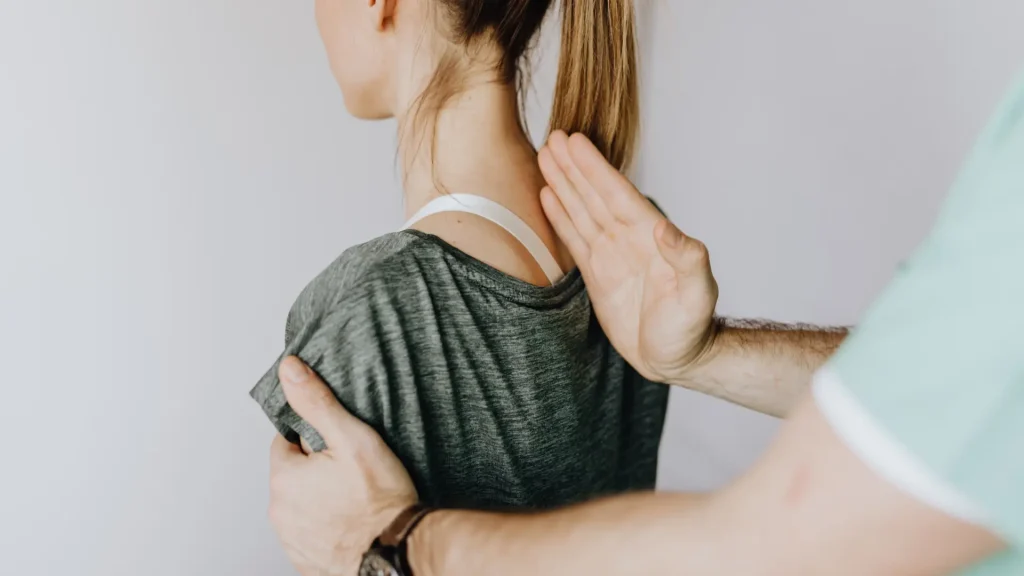 A person receiving a chiropractic adjustment on their back